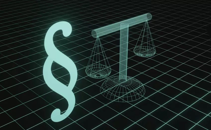 Green digital symbols of justice, a scale and a paragraph, on black background. Photo.